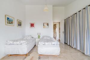 Posteľ alebo postele v izbe v ubytovaní Townhouse close to the beach