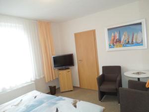 TV a/nebo společenská místnost v ubytování Hotel Gode Wind