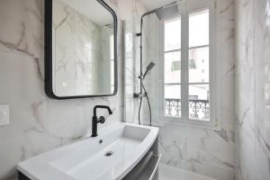 Kúpeľňa v ubytovaní 3G#Appart 6Pers#2 Chambres#Commerce#Paris 15#AC
