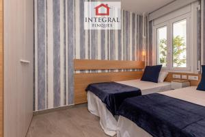 Posteľ alebo postele v izbe v ubytovaní Les Terrasses Apartament Palamós