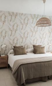 A bed or beds in a room at Los Castellanos nº 8 Suances