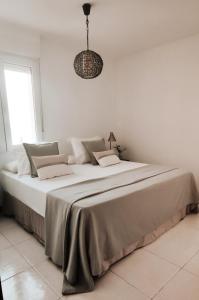 A bed or beds in a room at Los Castellanos nº 8 Suances