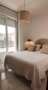 A bed or beds in a room at Los Castellanos nº 8 Suances