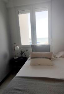 A bed or beds in a room at Los Castellanos nº 8 Suances