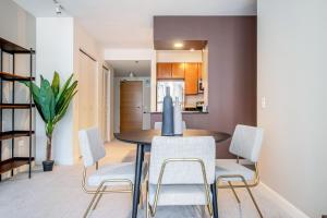 a kitchen and dining room with a table and chairs at Loop 1BR w Pool Gym nr Financial District CHI-261 in Chicago