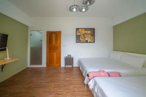 Cama o camas de una habitación en GREEN INN