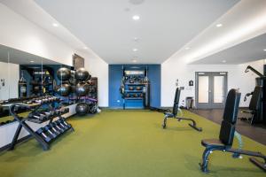 a gym with lots of treadmills and exercise equipment at Arlington Heights 2BR w Gym WD nr I-90 CHI-687 in Arlington Heights