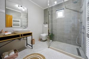 a bathroom with a shower and a sink and a toilet at Apartment Simunic Punta in Bibinje +51 photos