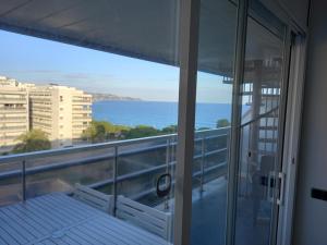a balcony with a view of the ocean at Appart Cosy T3 (Vue Mer et Piscine 4-5 pers) in Blanes