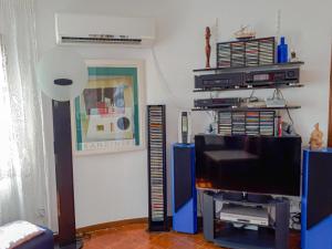 A television and/or entertainment centre at Club Villamar - Bordeus