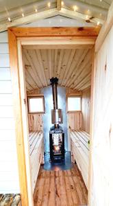 an inside view of a stove in a tiny house at Glamping in - luxury tent 
