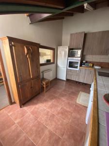 Kuchyň nebo kuchyňský kout v ubytování Apartamento el Remiendu Pegau