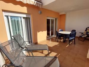 a living room with a table and chairs at Casa Verso Vera Playa in Vera