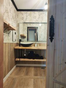 a bathroom with a sink and a mirror at Casa Burbuja Azul in Gran Tarajal