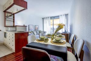 a kitchen and dining room with a table and chairs at Residence De Vacance, superb 3 room apartment with in Saint-Laurent-du-Var