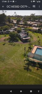 an aerial view of a yard with a swimming pool at Mi Buen Refugio in Puerto Iguazú