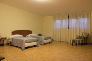 Postel nebo postele na pokoji v ubytování Ruggiero Park Hotel + 19 fotografií