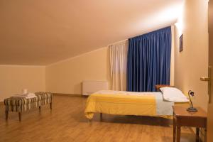 Postel nebo postele na pokoji v ubytování Ruggiero Park Hotel