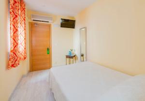 Postel nebo postele na pokoji v ubytování Hotel Manzanito