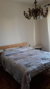 Ein Bett oder Betten in einem Zimmer der Unterkunft Appartamento Alice