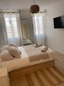 Posteľ alebo postele v izbe v ubytovaní Duplex place des lices + 3 fotografie