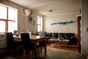 a living room with a couch and a table at ÖXL Snæfellsnes in Snæfellsbær