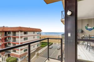 a balcony with a view of the ocean at Sand & Sea: Neawanna Creek (414) in Seaside
