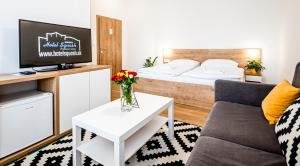 Postel nebo postele na pokoji v ubytování Hotel Squash Dependance