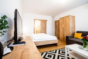 TV o dispositivi per l'intrattenimento presso Hotel Squash Dependance