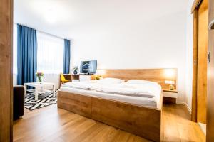 Letto o letti in una camera di Hotel Squash Dependance