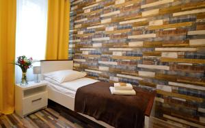 Posteľ alebo postele v izbe v ubytovaní Cracow Central Aparthotel