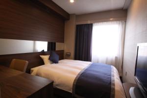 Postel nebo postele na pokoji v ubytování Hotel Il Credo Gifu