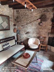 a living room with a couch and a table at Angel's Traditional House 