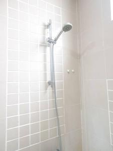a shower with a shower head in a bathroom at [HERITAGE 5] HOMESTAY Studio 4Pax, FREE WIFI in Seri Kembangan