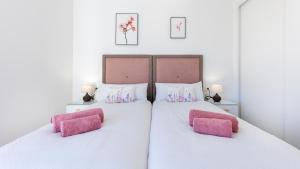 Łóżko lub łóżka w pokoju w obiekcie Villa Arcadia