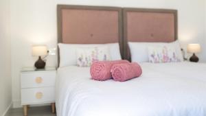 Łóżko lub łóżka w pokoju w obiekcie Villa Arcadia
