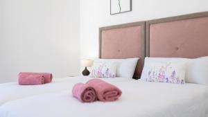 Łóżko lub łóżka w pokoju w obiekcie Villa Arcadia