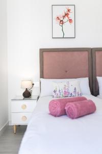 Łóżko lub łóżka w pokoju w obiekcie Villa Arcadia