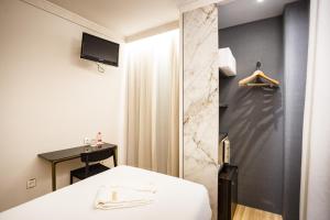 Postel nebo postele na pokoji v ubytování Hotel Dauro Premier