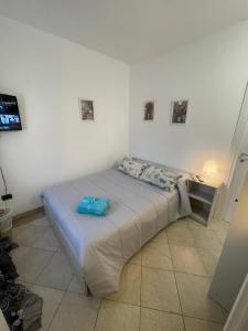 Postel nebo postele na pokoji v ubytování La Casetta di Azzurra Camera Dany