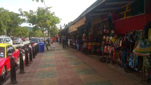 a street with a store on the side of the road at Langgura Baron Resort in Pantai Cenang