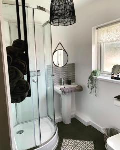 a bathroom with a shower and a sink at 10 Minutes Walk To The Beach in Port Talbot