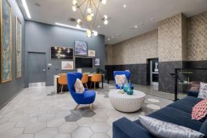 a living room with blue furniture and a fireplace at Downtown 1BR w Pool Gym nr Staples Center LAX-625 in Los Angeles
