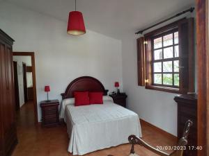 A bed or beds in a room at Casa Magali