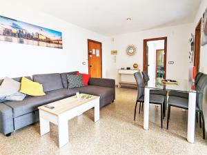 a living room with a couch and a table at Apartment Coblanca XVI by Interhome in Cala de Finestrat