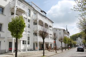 a white building on the side of a street at Villa Allegra by Rujana in Binz