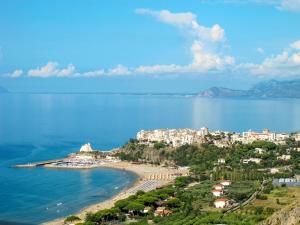 a view of a beach with houses and the ocean at Apartment Costa di Kair ed Din-6 by Interhome in Sperlonga