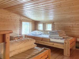 Postel nebo postele na pokoji v ubytování Holiday Home Ylläsrivit c 8 - villa änkyrä by Interhome