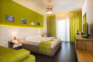 Posteľ alebo postele v izbe v ubytovaní Lagaria Hotel