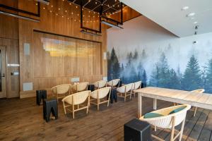 a dining room with a mural of trees on the wall at Mountain View 1br w gym pool wd nr 84 SFO-1337 in Sunnyvale +35 photos